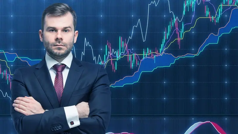 Hombre de traje con gráficos financieros al fondo